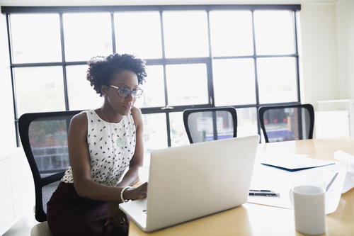 businesswoman in front of a laptop
