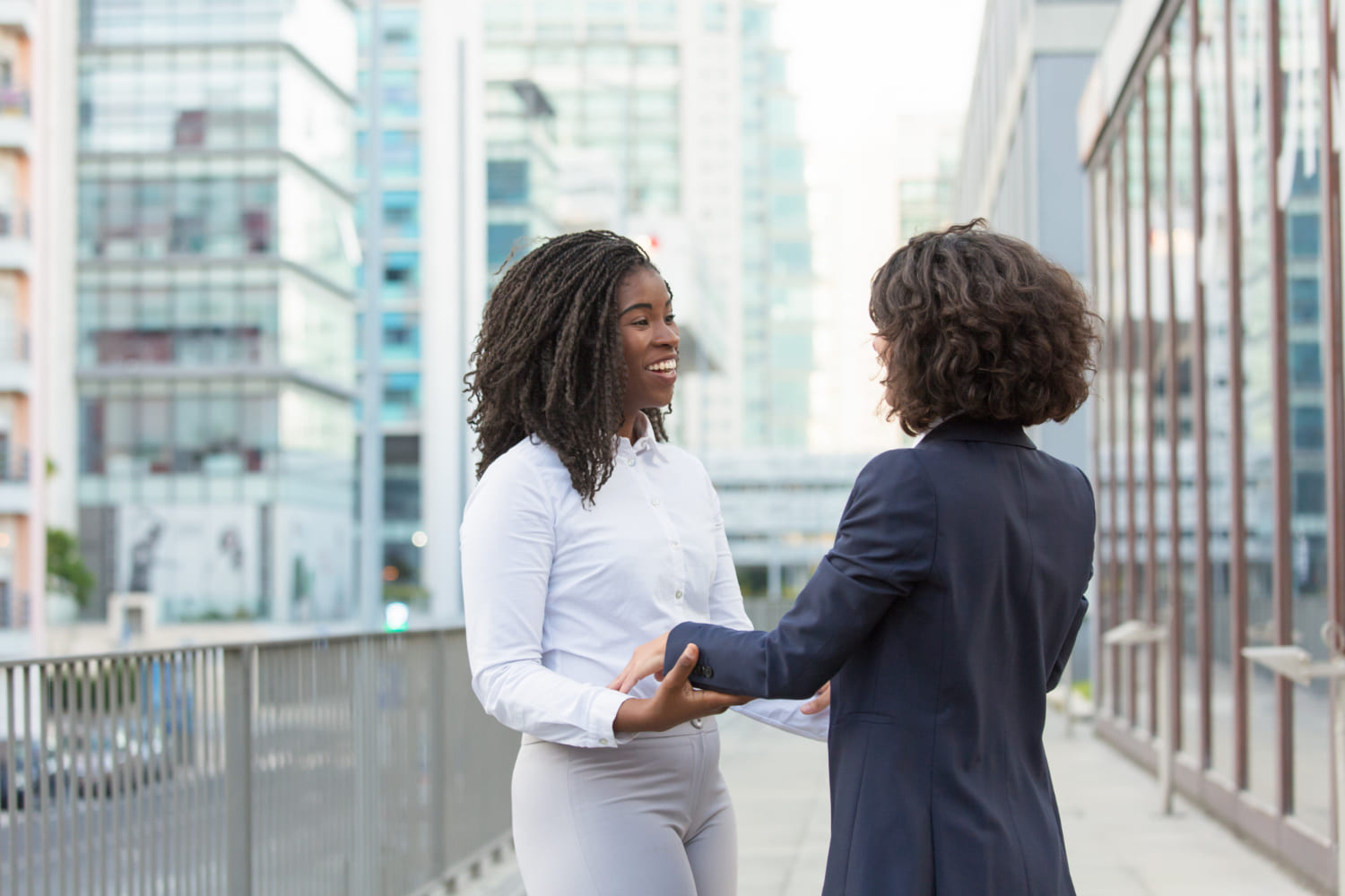 two businesswomen facing each other