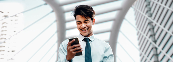 A businessman holding a phone
