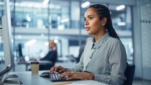 businesswoman in front of a laptop
