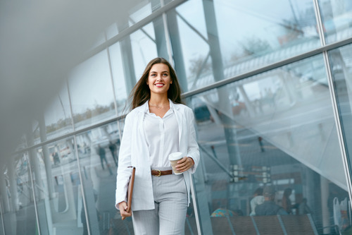 A businesswoman walking and thinking about temp work