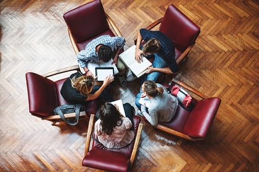 coworkers sitting around in circle