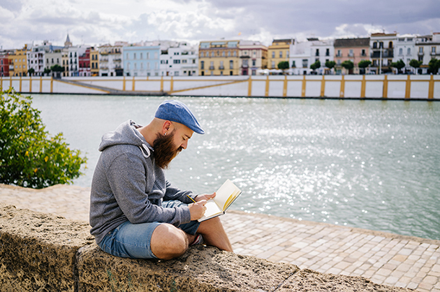 man near river in the city