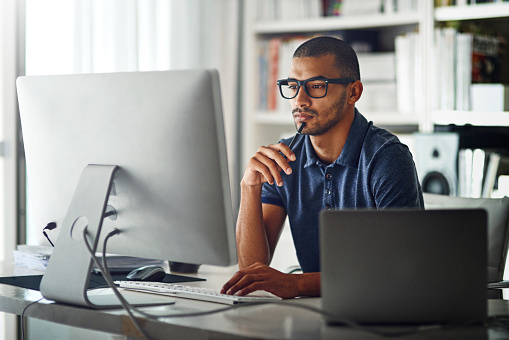 man sitting at computer