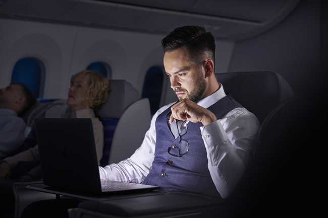 man working in the dark on laptop