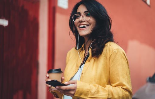 woman with coffe and phone