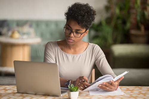 businesswoman looking at a laptop