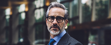 Picture of businessman in front of office building