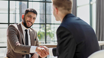 Two colleagues shaking hands