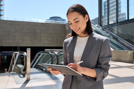businesswoman writing on a pad